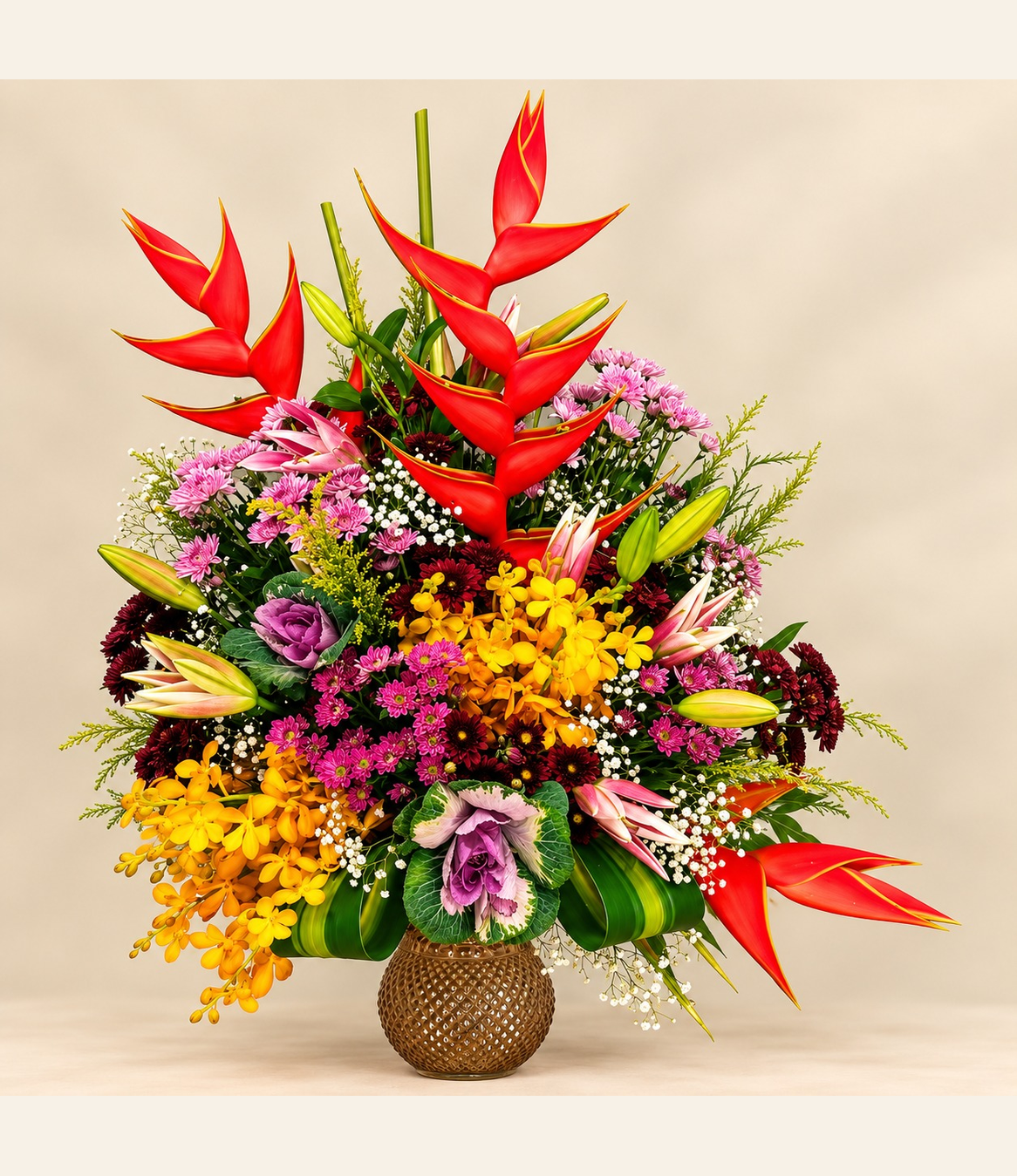 Exotic red heliconia and pink lily floral arrangement with yellow blooms, burgundy flowers and lush greenery by Whitefields.